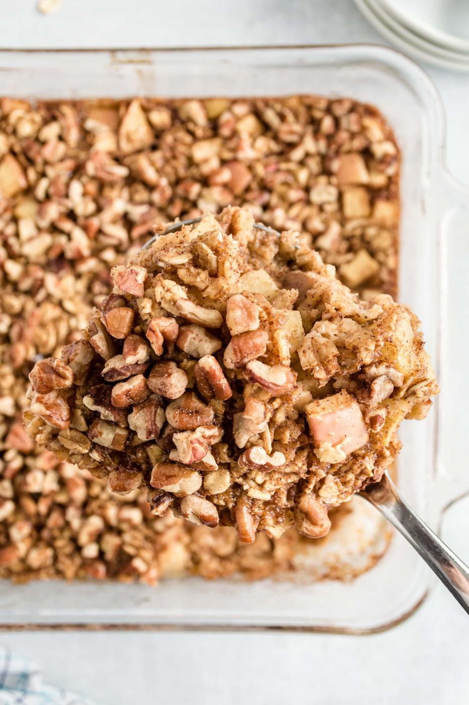 An apple baked oatmeal with granola topping in a baking dish.
