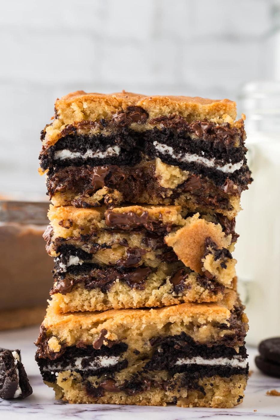 Baked oreo cookie bars stacked.
