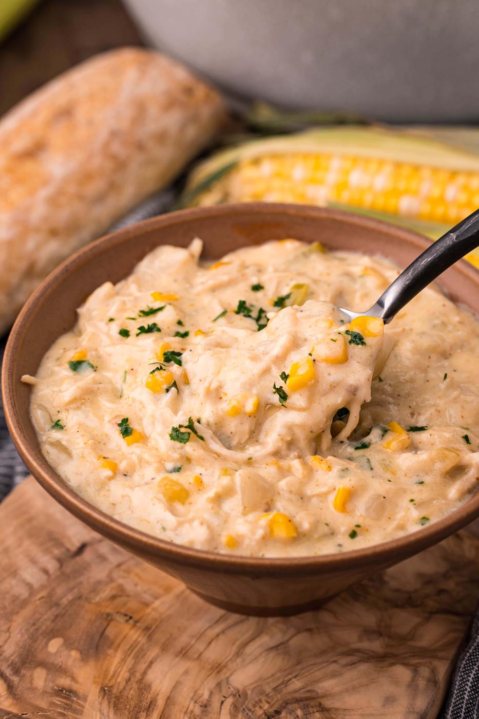 Easy corn chowder recipe served in a bowl with a spoon.
