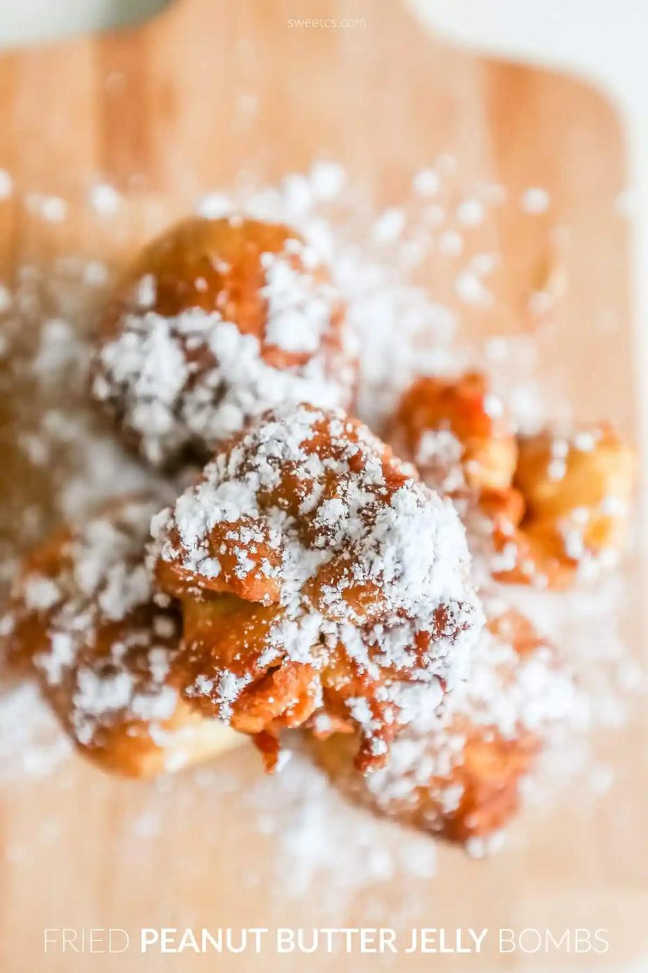 Peanut butter jelly bomb recipe features free fried bombs on a cutting board.