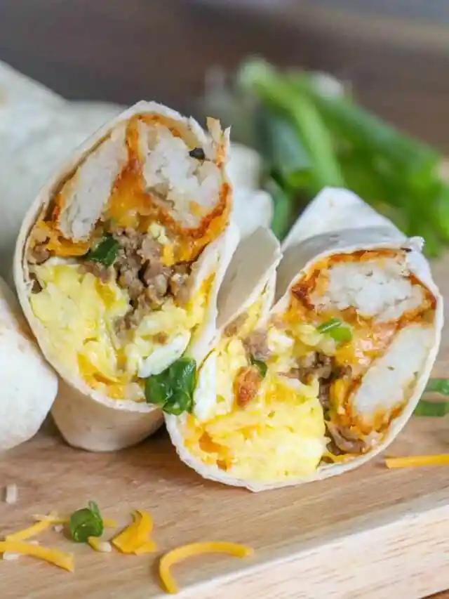 A burrito with eggs and cheese on a cutting board.