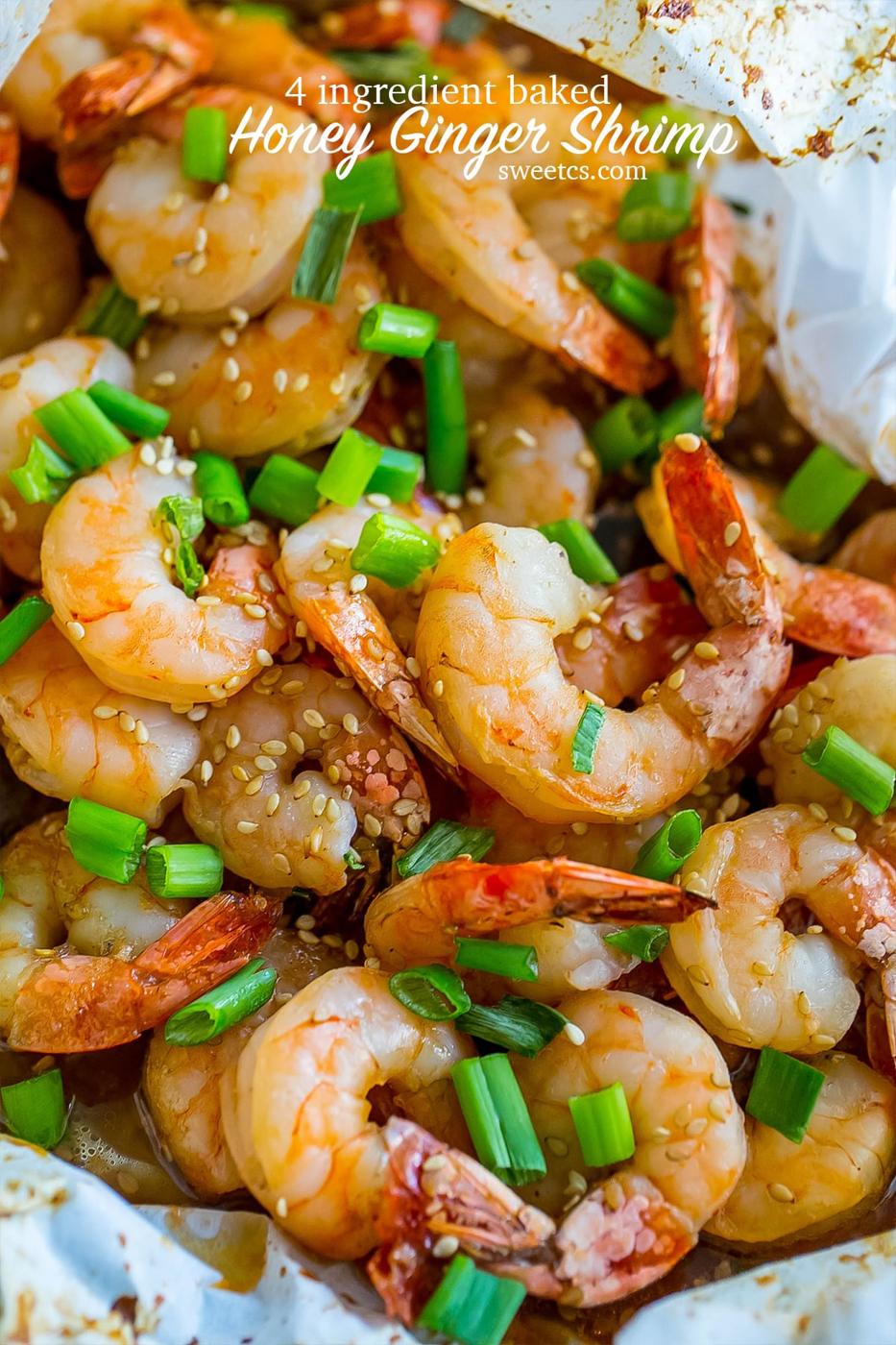 cooked shrimp with sesame seeds and green onions on them