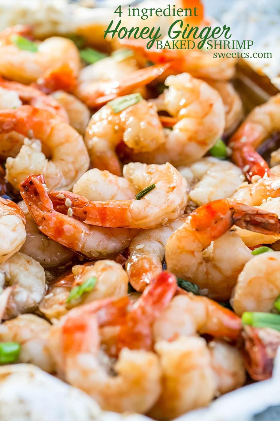 cooked shrimp with sesame seeds and green onions on them