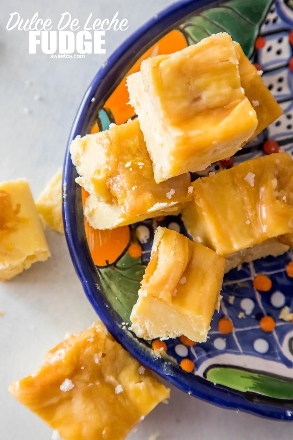 A plate with pieces of Dulce De Leche and Cake Batter fudge on it.