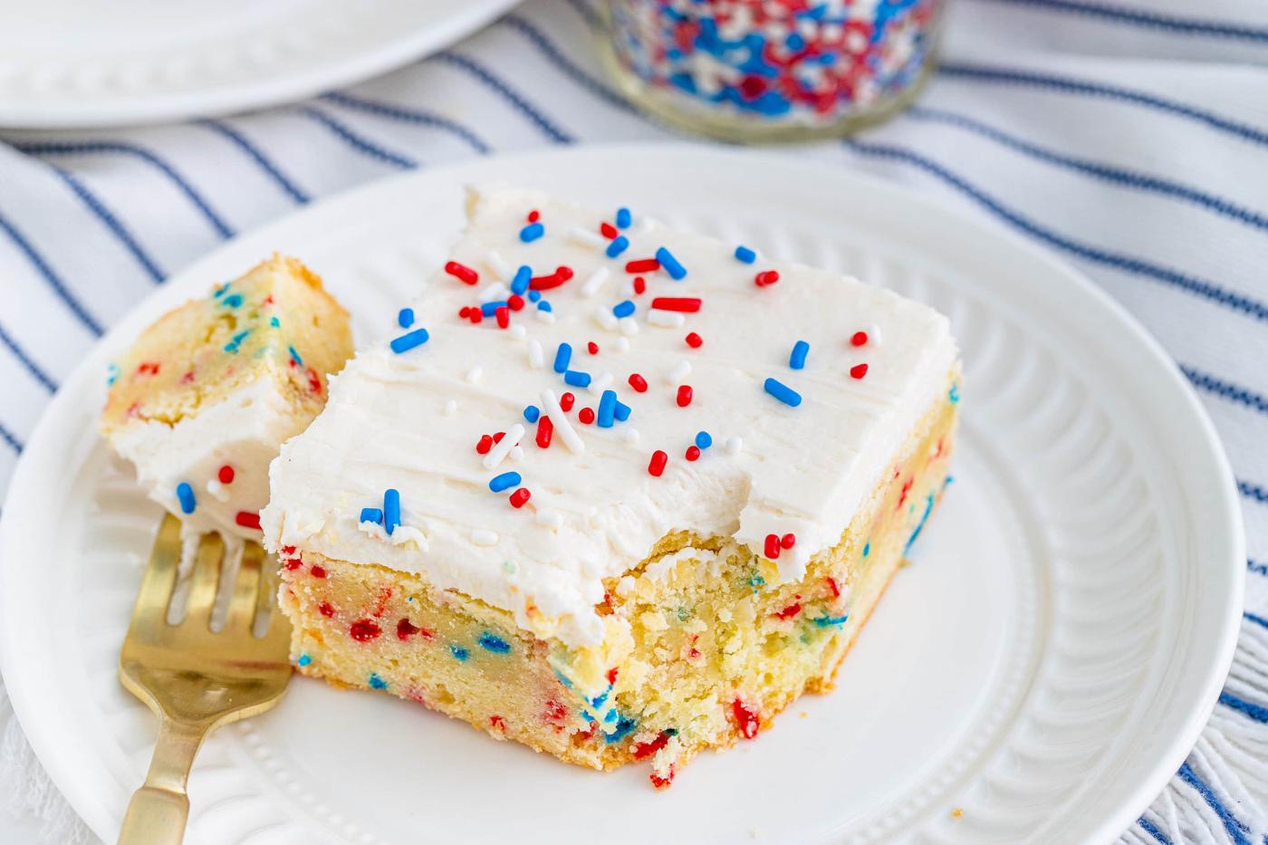 a vanilla bar with red and blue sprinkles in them and on frosting on top