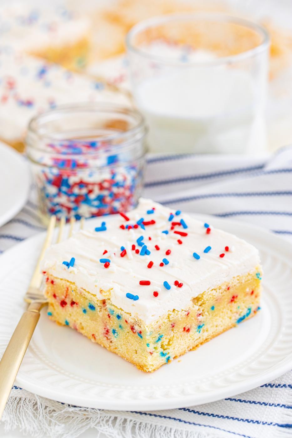 a vanilla bar with red and blue sprinkles in them and on frosting on top