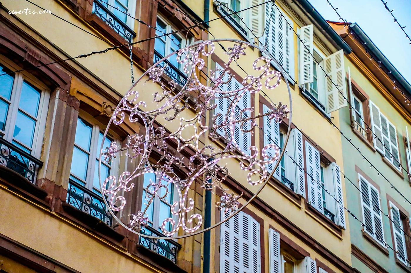 A festive Christmas decoration adorns a building in the magical city of Strasbourg, France.