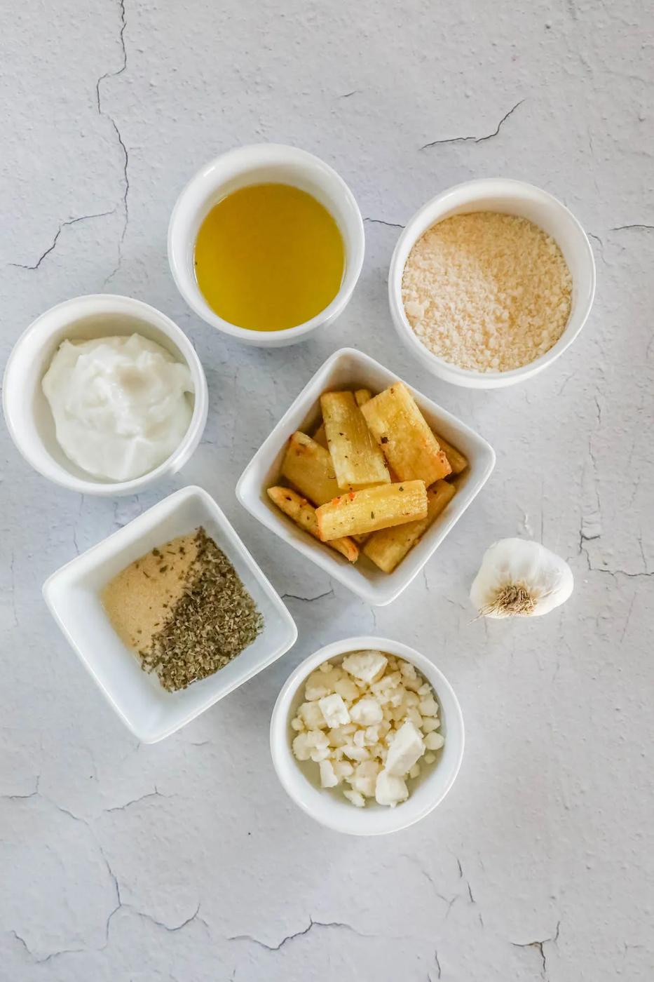 picture of feta, olive oil, cheese, pasta, garlic on a table