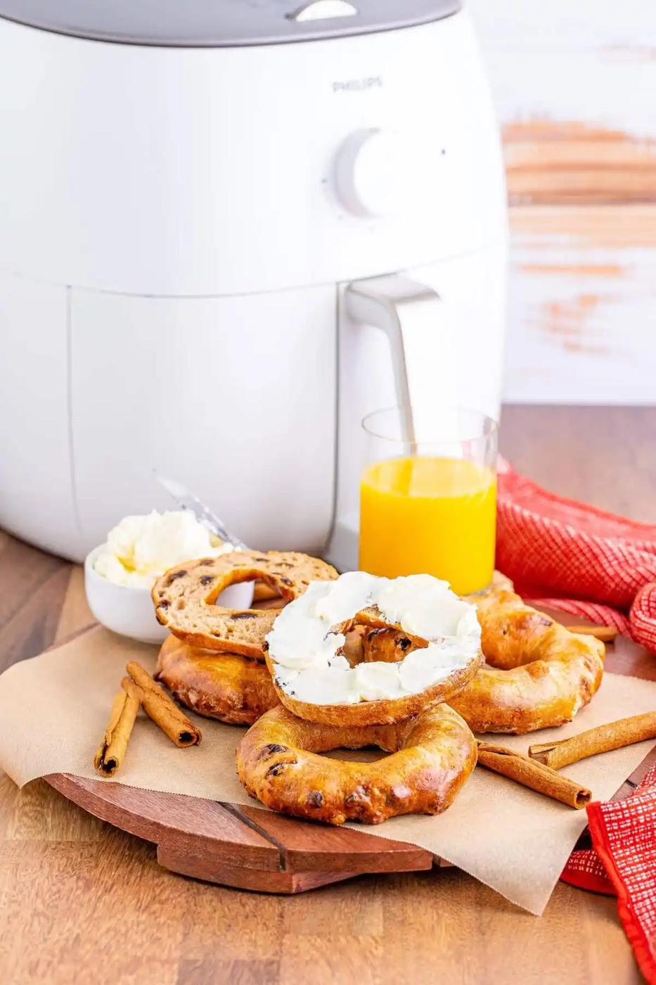 An air fryer with white color on a wooden table.