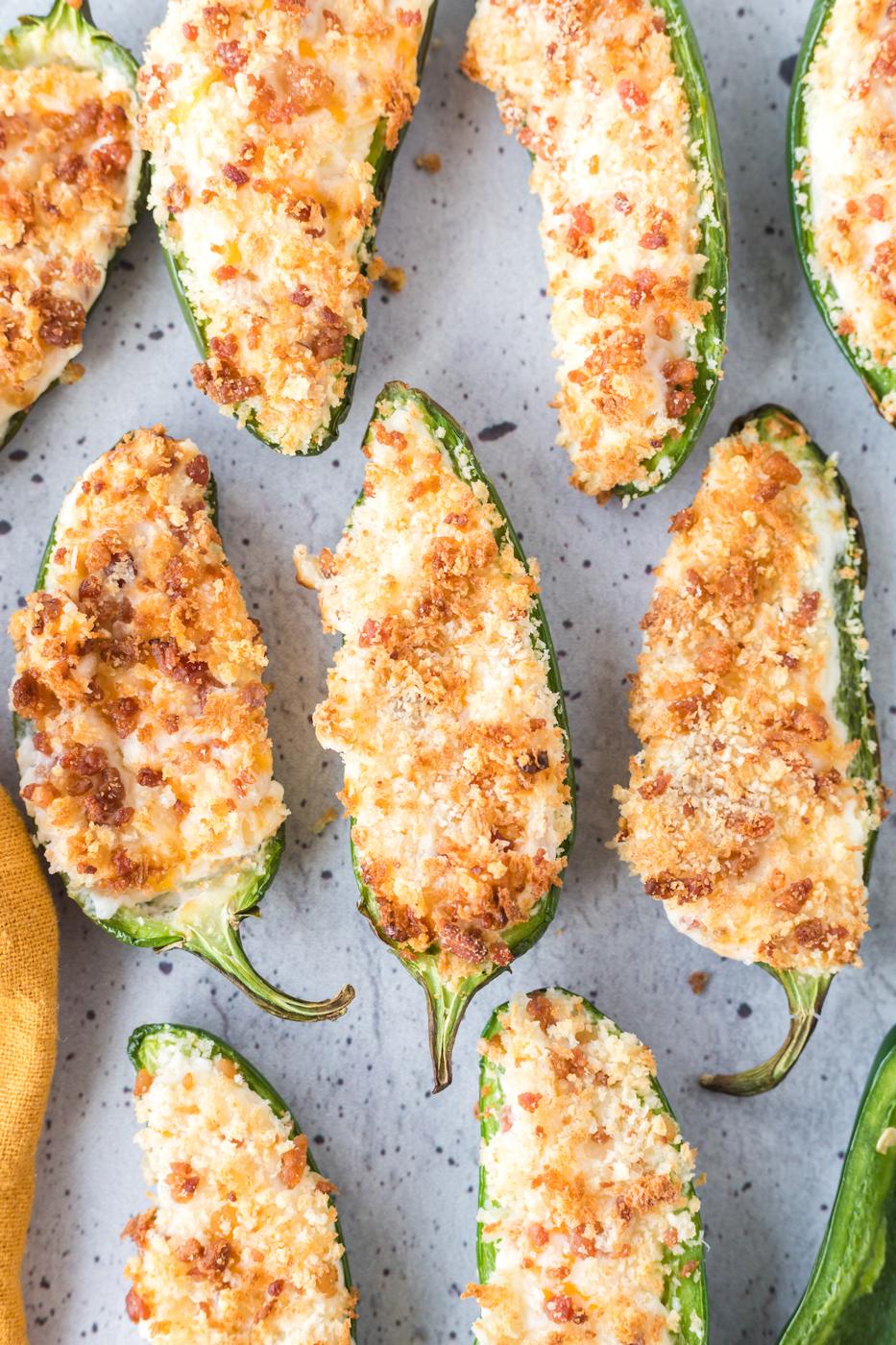 air fried jalapeño poppers stuffed with cream cheese filling and topped with panko breadcrumbs air fried to crispy brown on a white plate