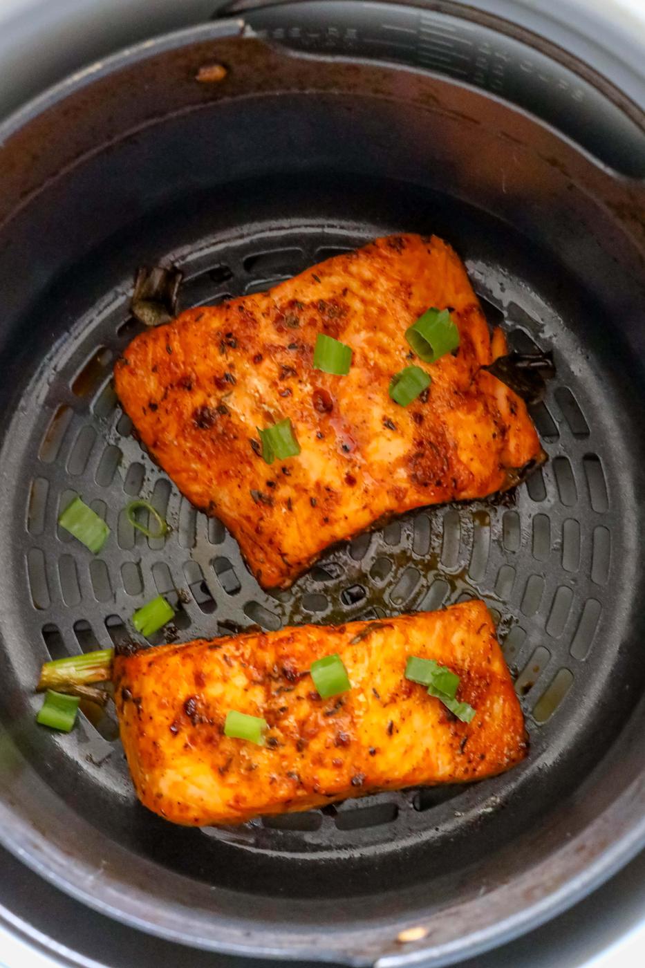 spicy salmon cooked in an air fryer basket
