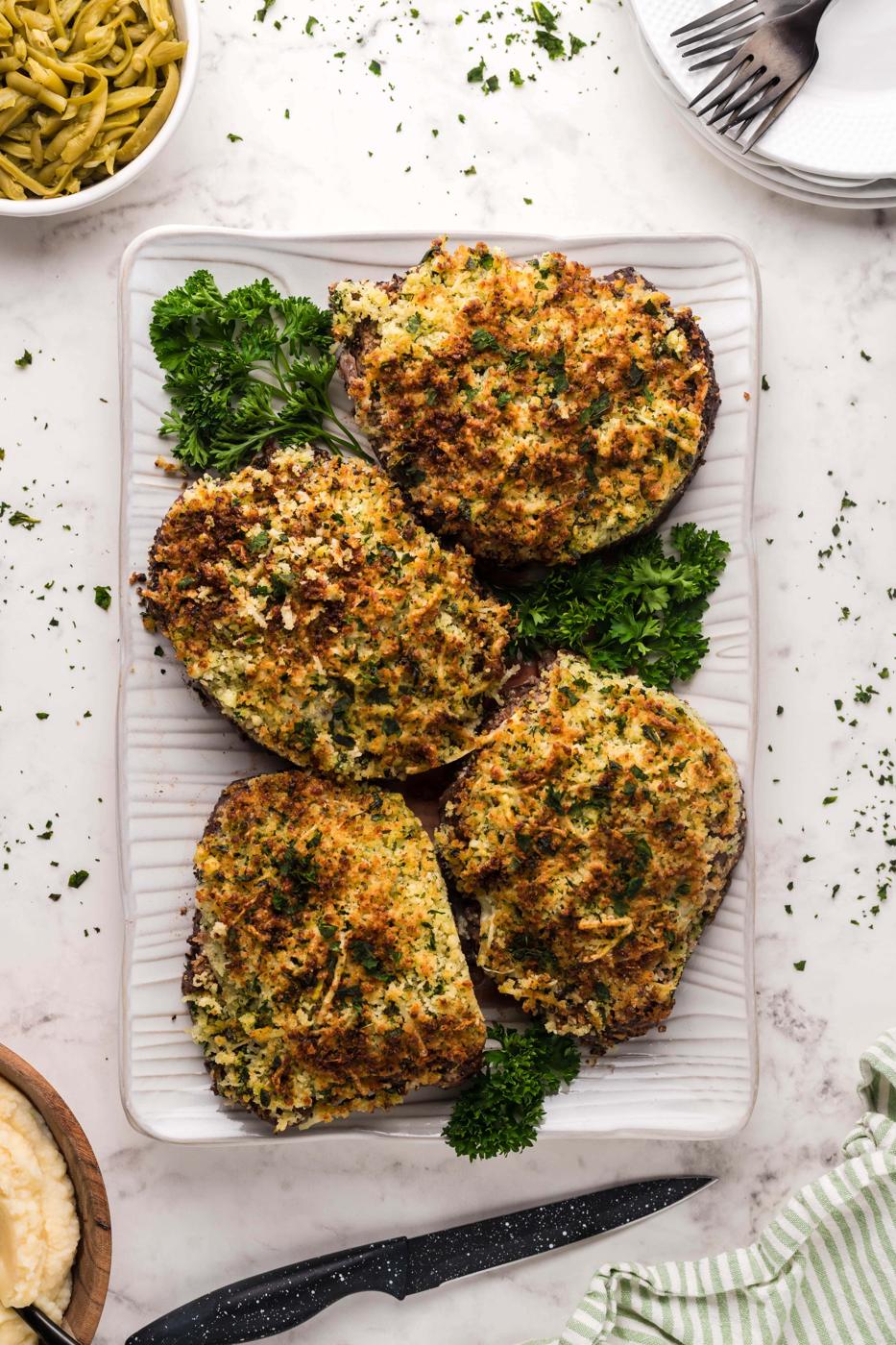 Stuffed mushrooms and green beans plated with a parmesan crust.