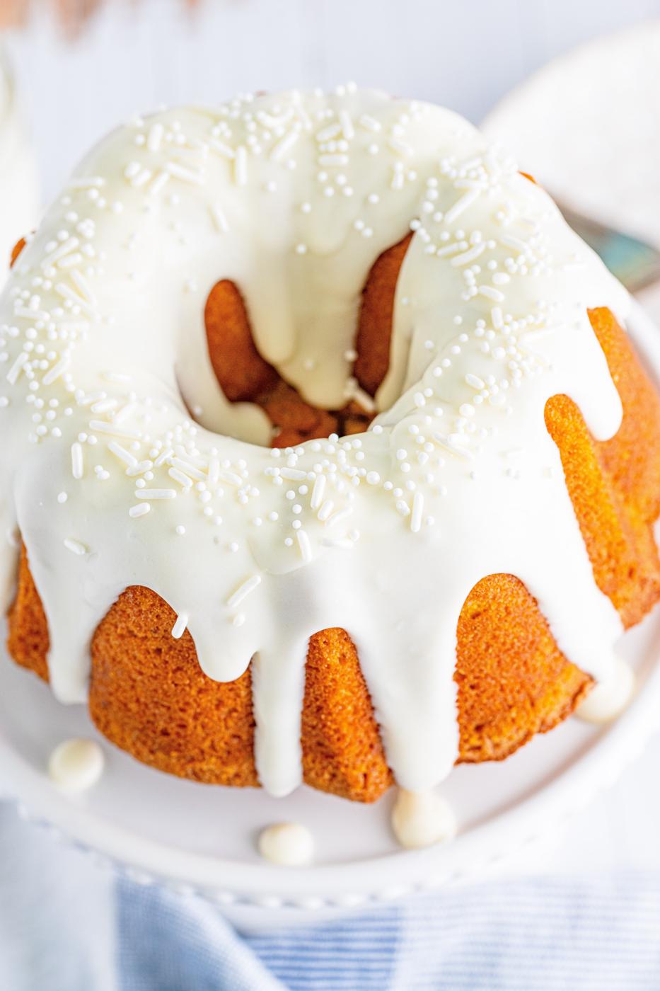 picture of air fryer pumpkin bundt cake on a white cake stand