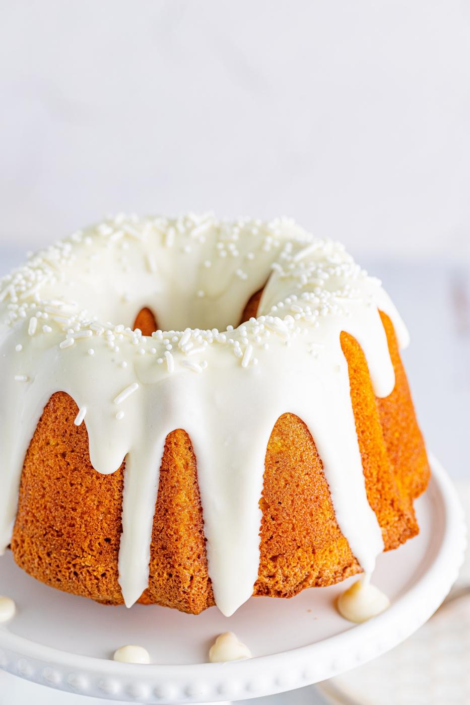 picture of air fryer pumpkin bundt cake on a white cake stand