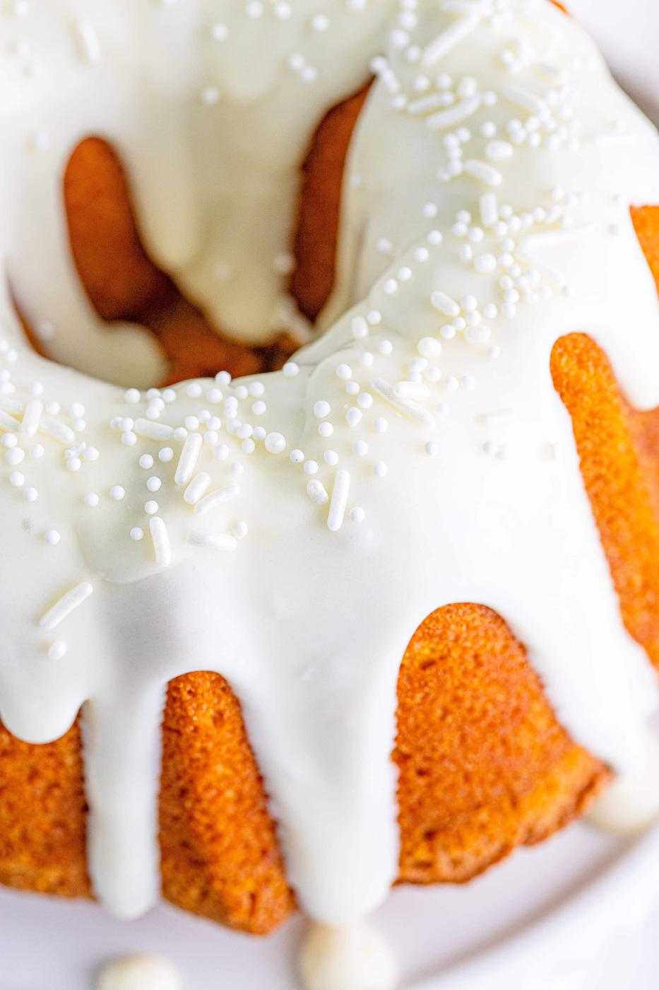 picture of air fryer pumpkin bundt cake on a white cake stand