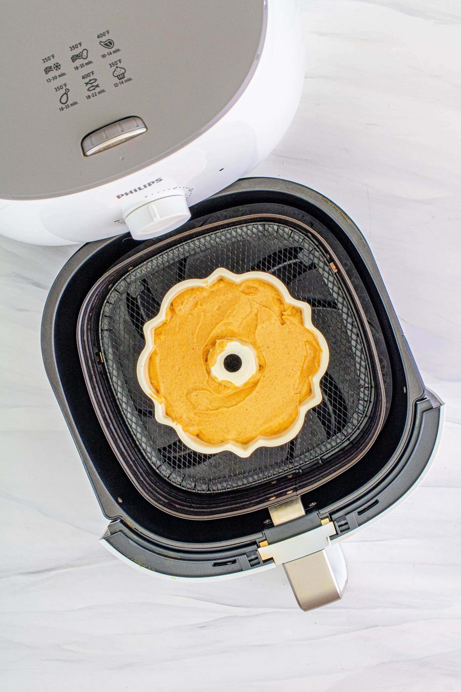 picture of bundt cake batter in a bundt pan in an air fryer basket