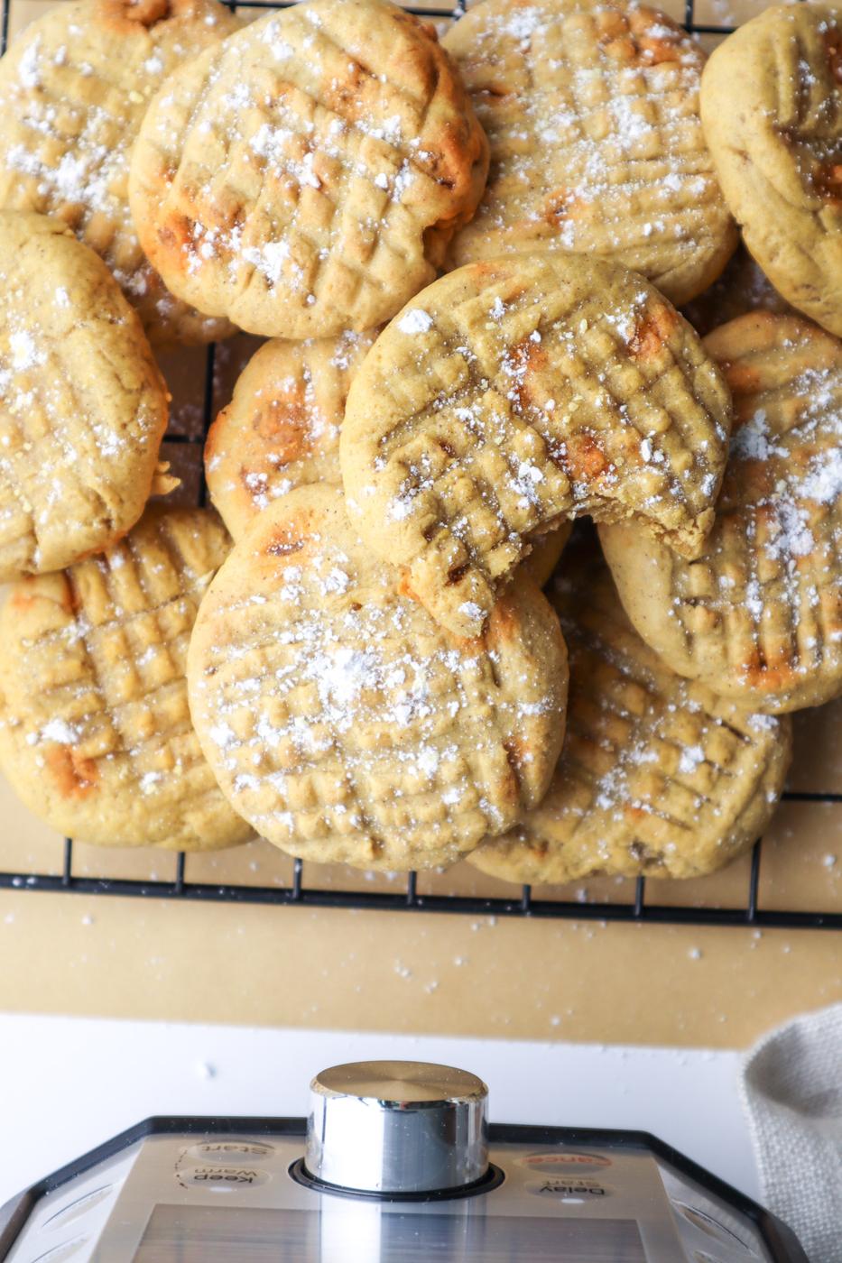 picture of pumpkin cookies with butterscotch chips on a cooling rack