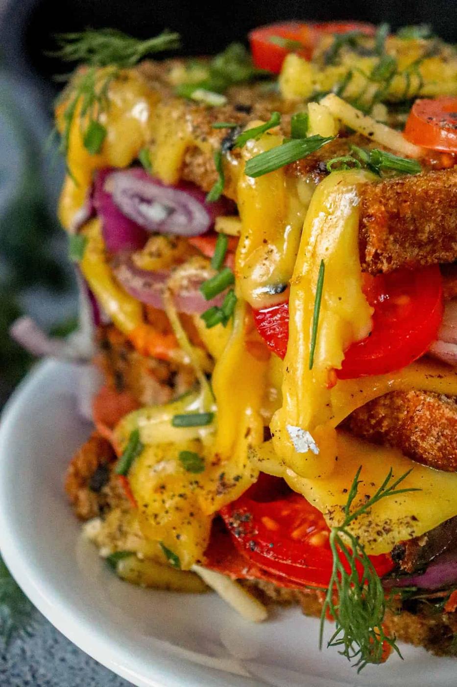 A stack of vegan sandwiches on a plate.