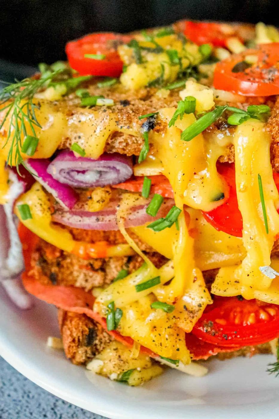 A stack of delicious vegan melts with vegetables on top, cooked in an air fryer.