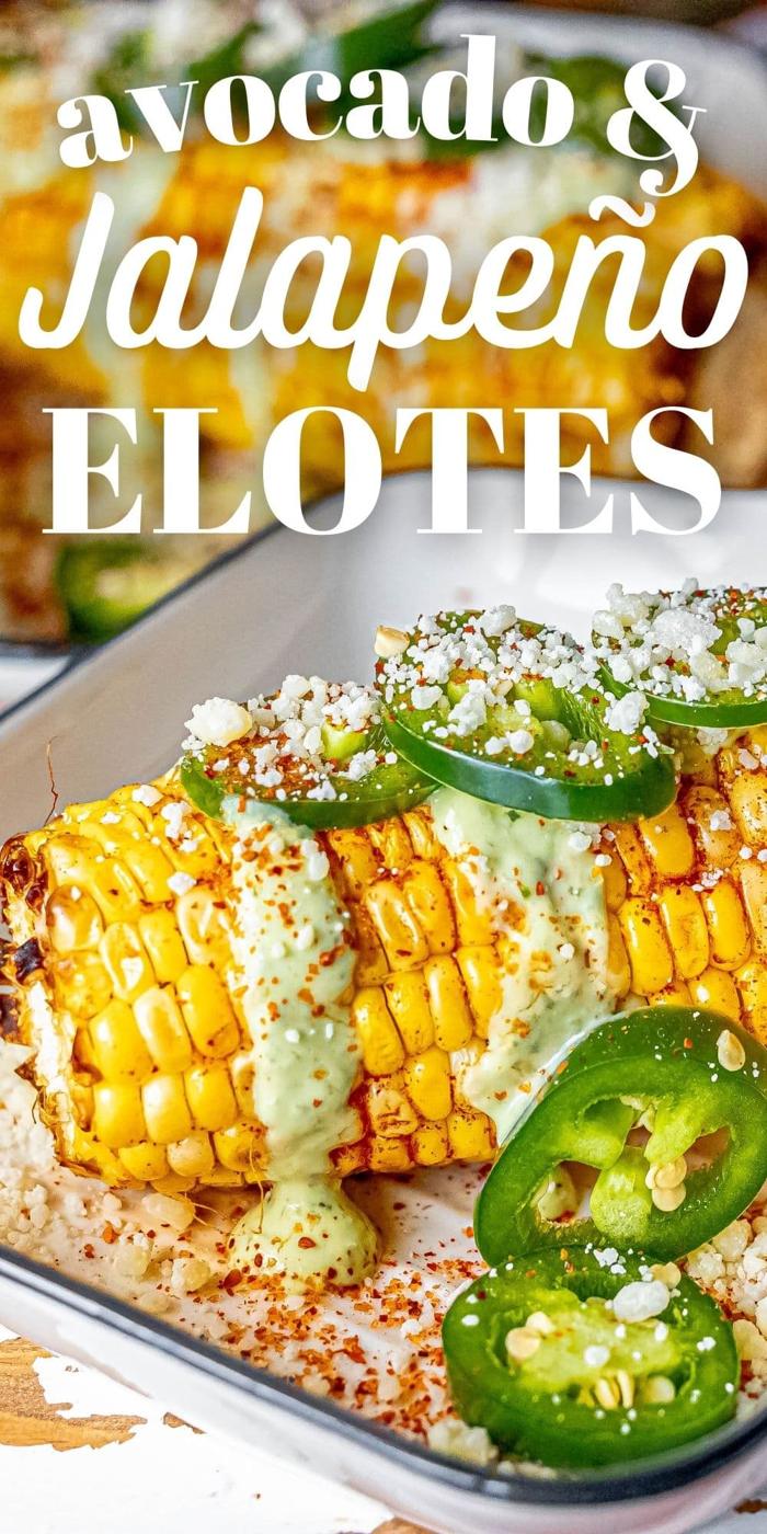 picture of elotes corn cob with crema, cheese, jalapenos, and spices on top