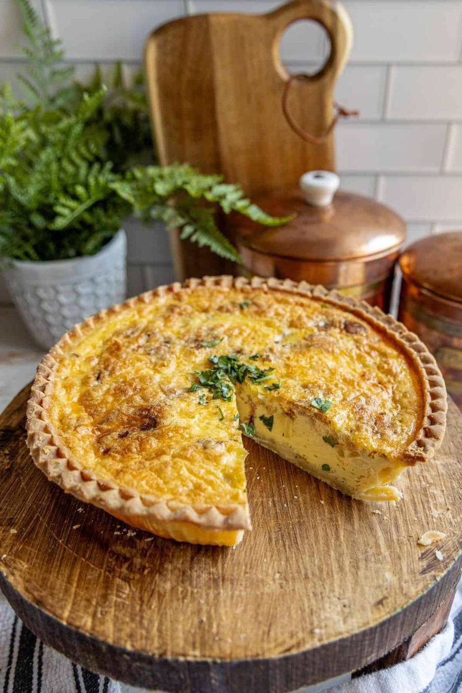 A quiche on a cutting board.