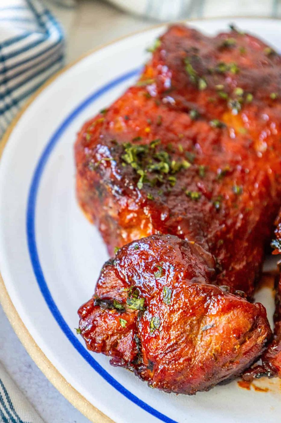 BBQ pork chops on a plate.