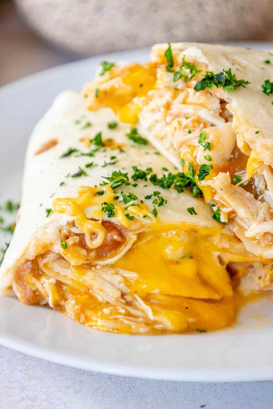 Baked cheesy chicken quesadilla on a white plate.