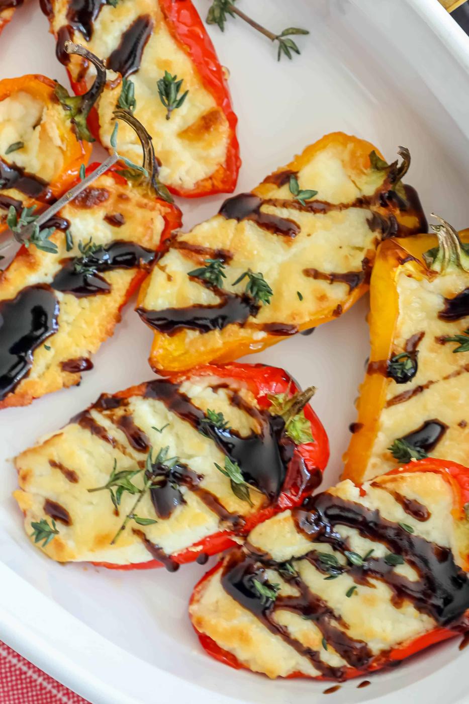A plate of baked food with goat cheese.