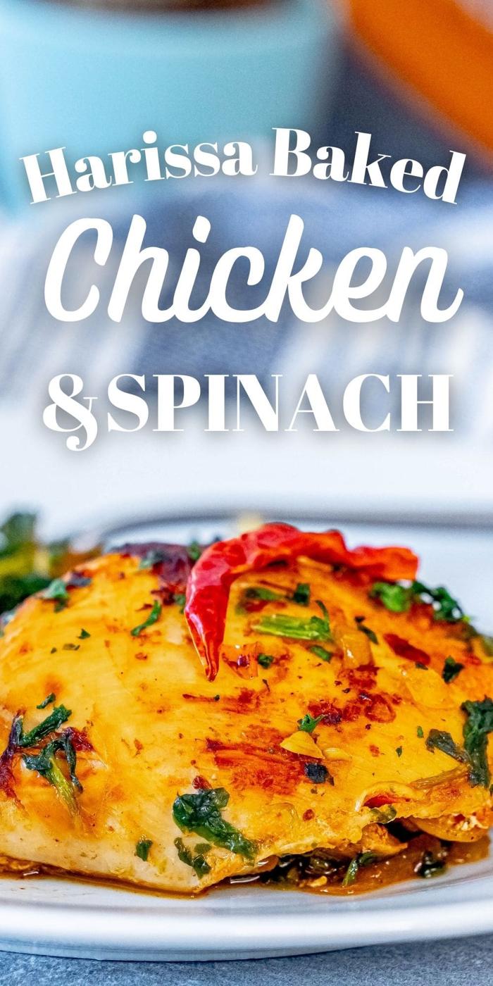 picture of harissa chicken and spinach on a white plate