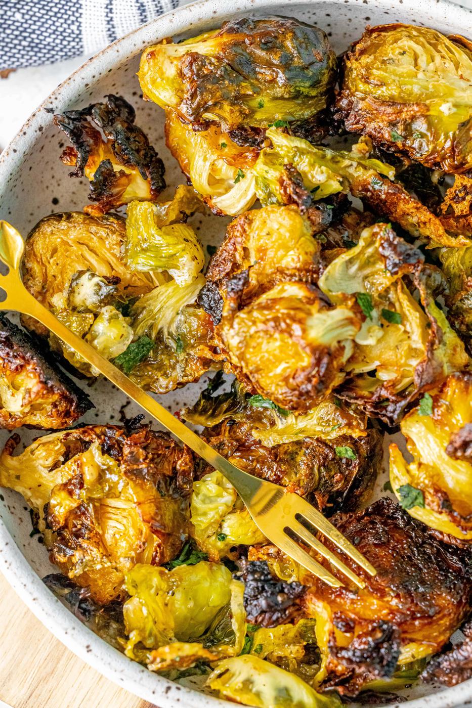 picture of caramelized ranch brussels sprouts in a white bowl