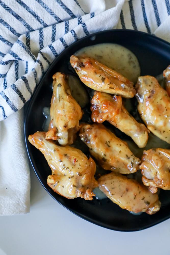 ranch chicken wings on a black plate