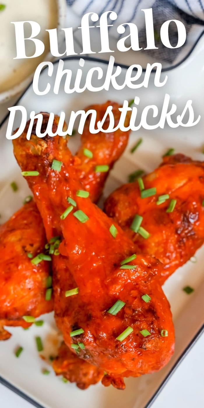 chicken drumsticks with red buffalo sauce on them