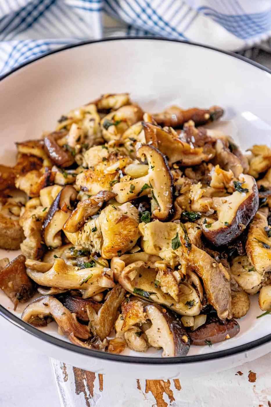 Mushrooms in a white bowl on a table.