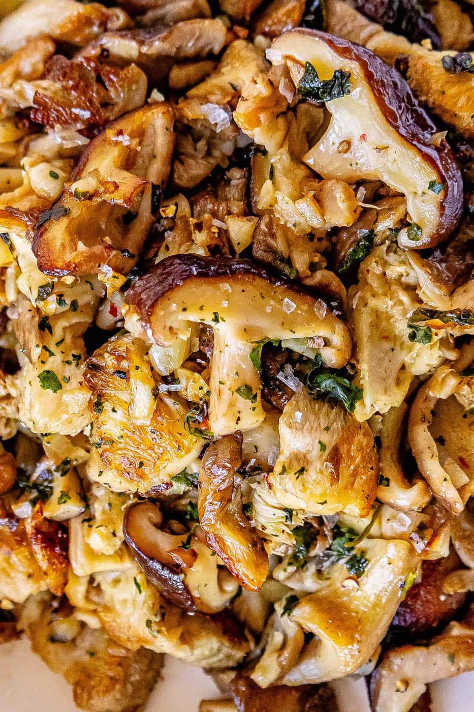 A plate full of mushrooms on a white plate.