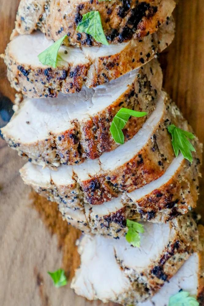 picture of pork tenderloin slices on a cutting board