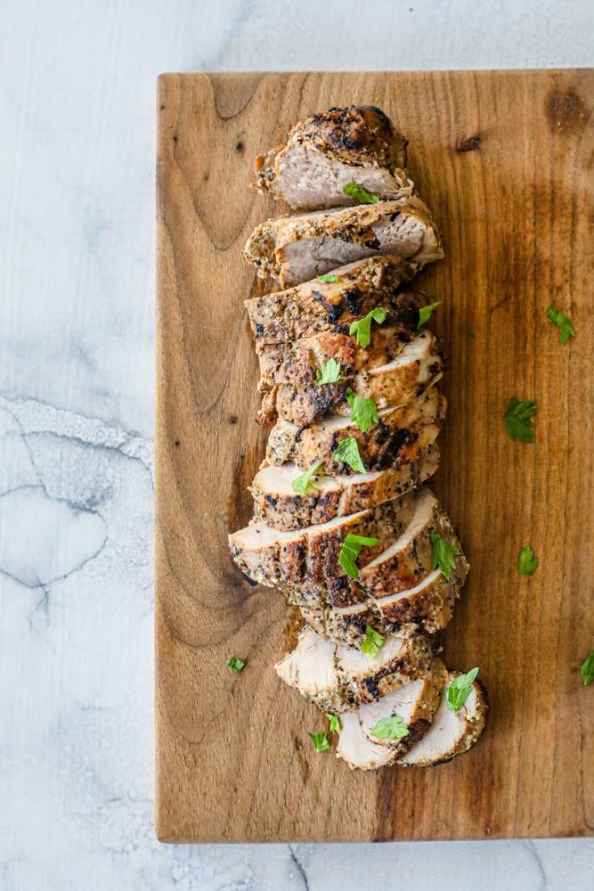 picture of pork tenderloin slices on a cutting board
