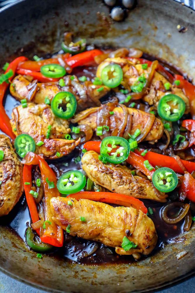chicken, onions, peppers, and jalapenos in a pot together