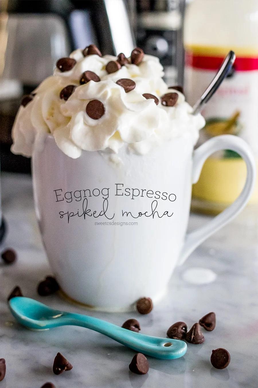 A mocha mug with whipped cream and chocolate chips.