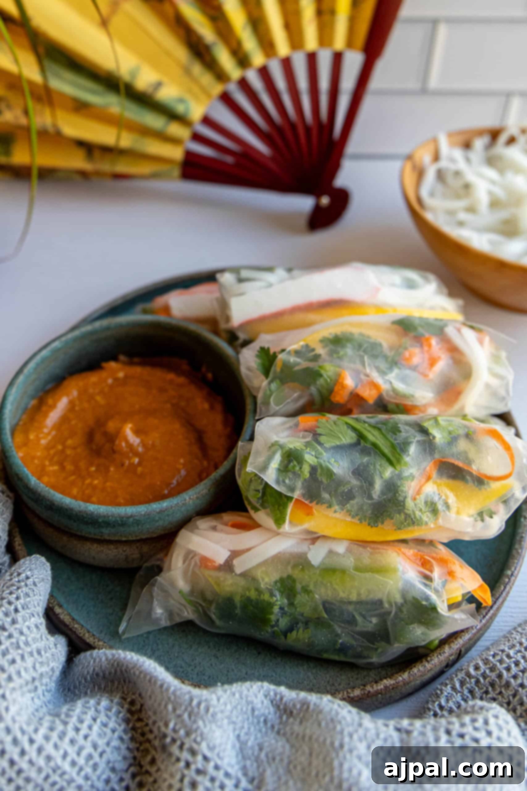Plate of Vietnamese crab spring rolls served with dipping sauce.