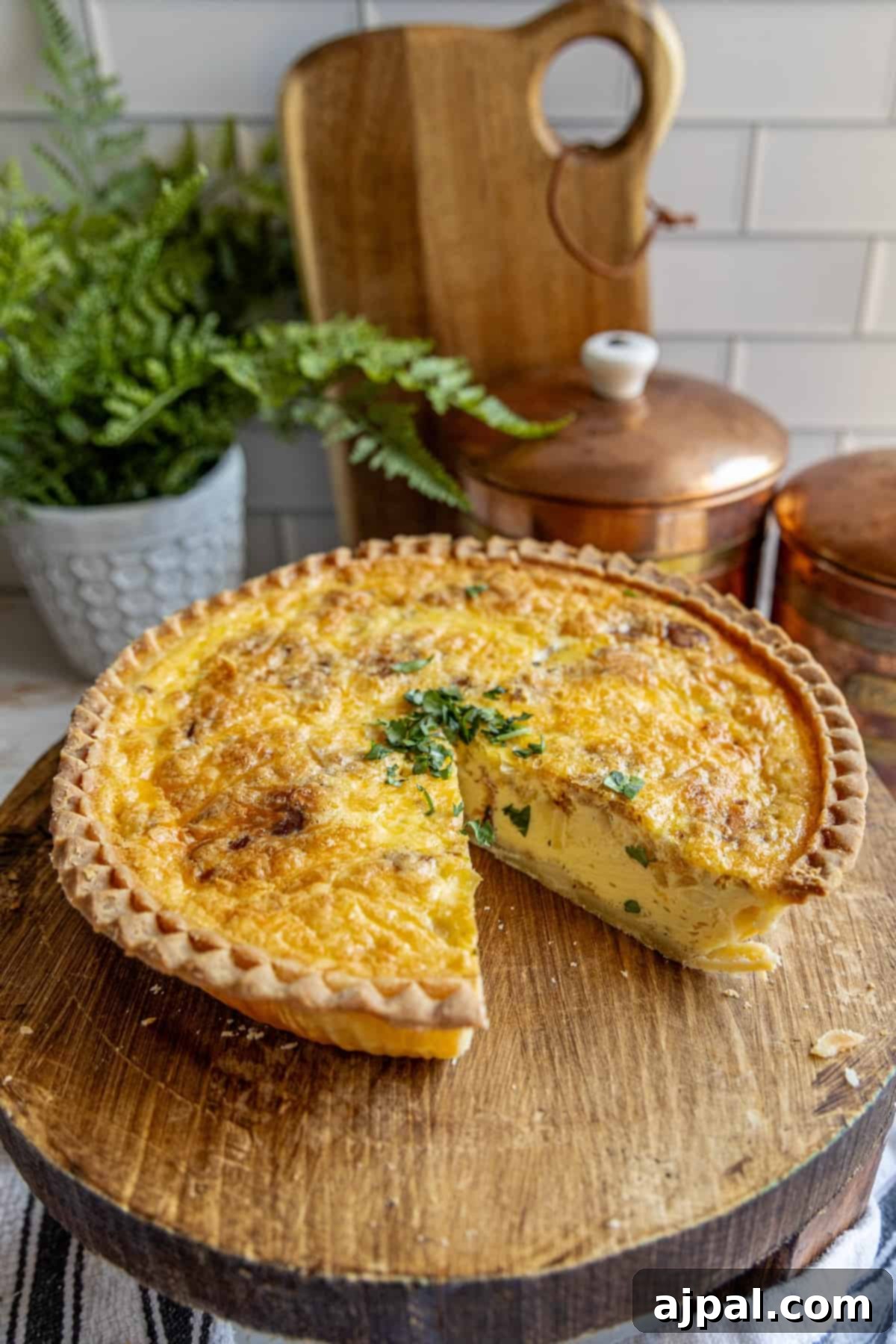 A delicious bacon and cheese quiche resting on a wooden cutting board, ready to be served.
