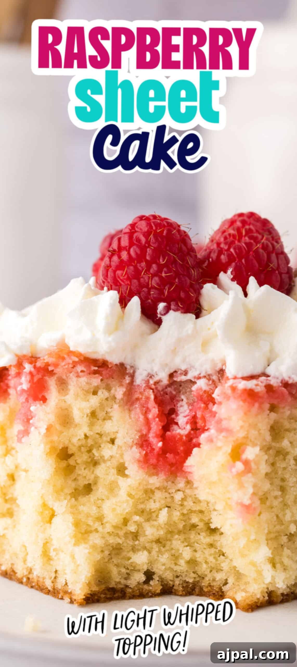 A stunning vertical shot of a raspberry sheet cake, featuring a generous topping of light whipped cream and perfectly arranged fresh raspberries, beckoning with its delicious appeal.