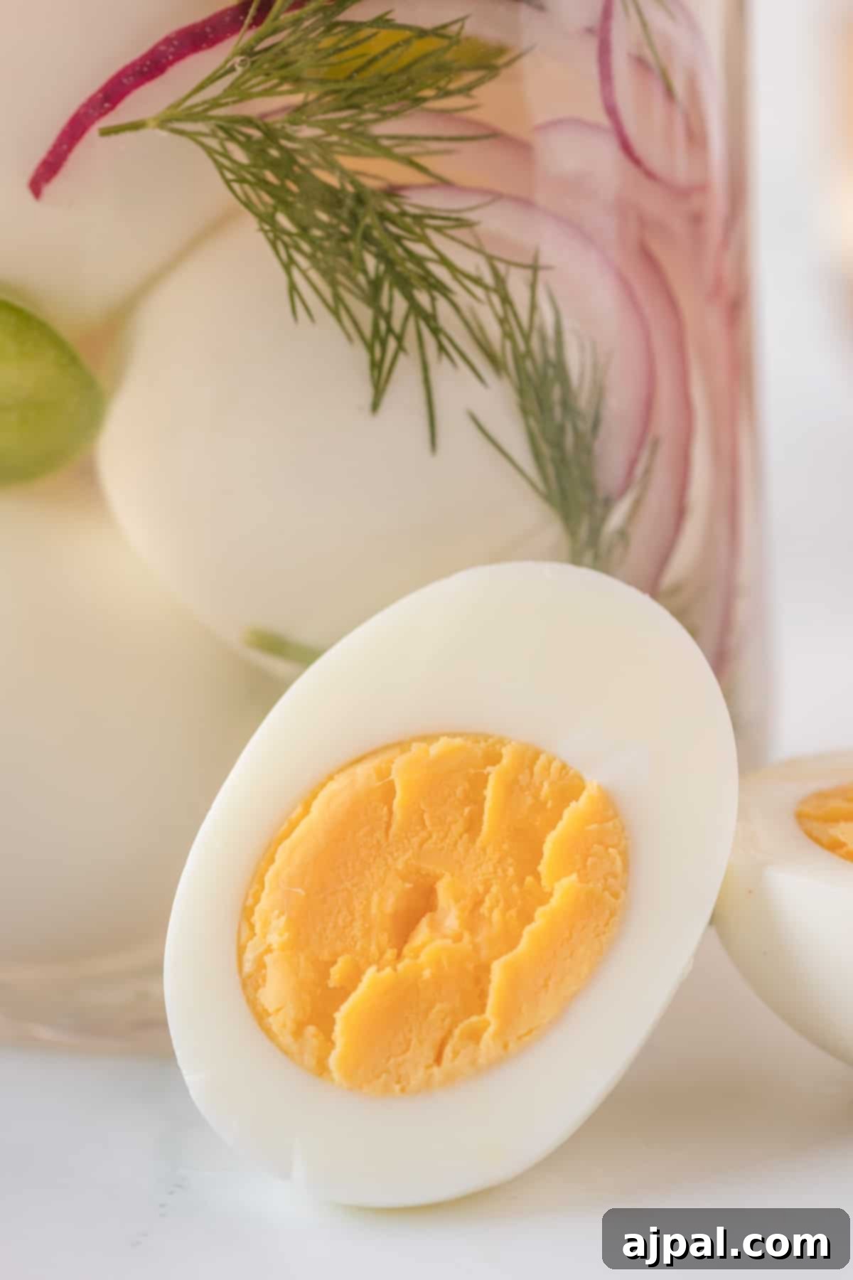Hard boiled eggs in a jar with dill, pickled for extra flavor.
