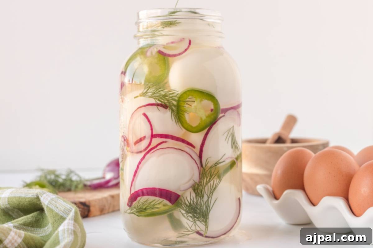 A spicy mason jar filled with pickled eggs and radishes.