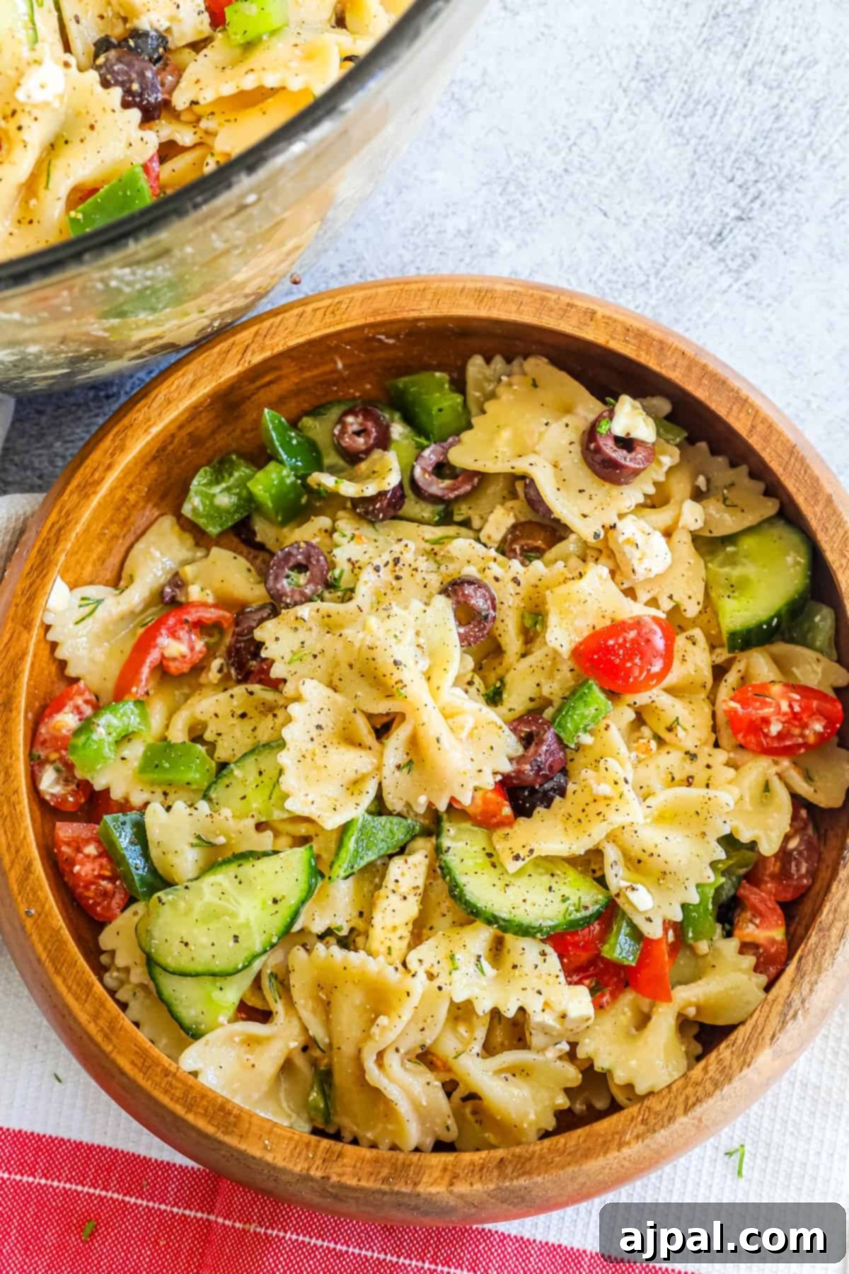 Zesty Greek Pasta Salad 2 A Greek pasta salad with tomatoes and cucumbers.