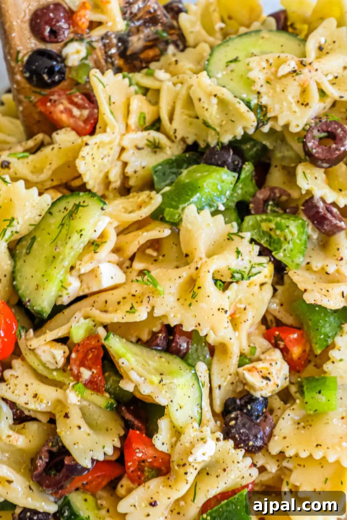 Zesty Greek Pasta Salad 3 A close up of a Greek pasta salad.