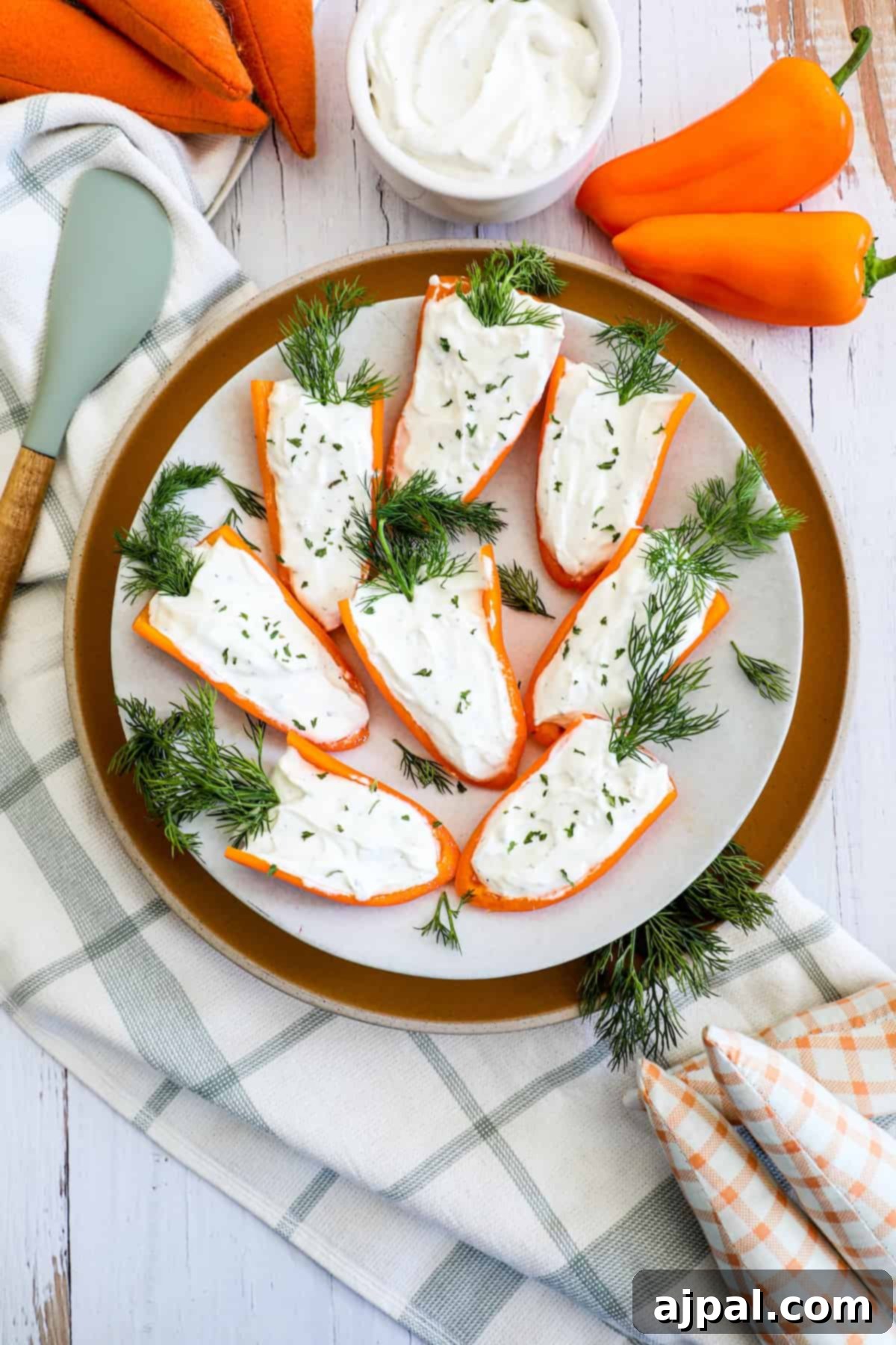 A plate with carrots and sour cream.