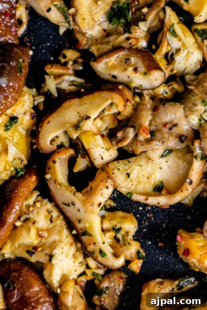 Roasted mushrooms sautéed in garlic butter with herbs.