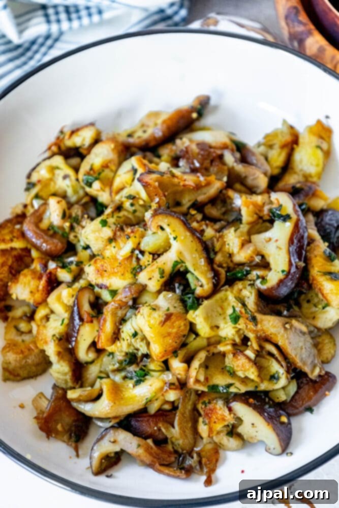 picture of sauteed mushrooms in a white bowl