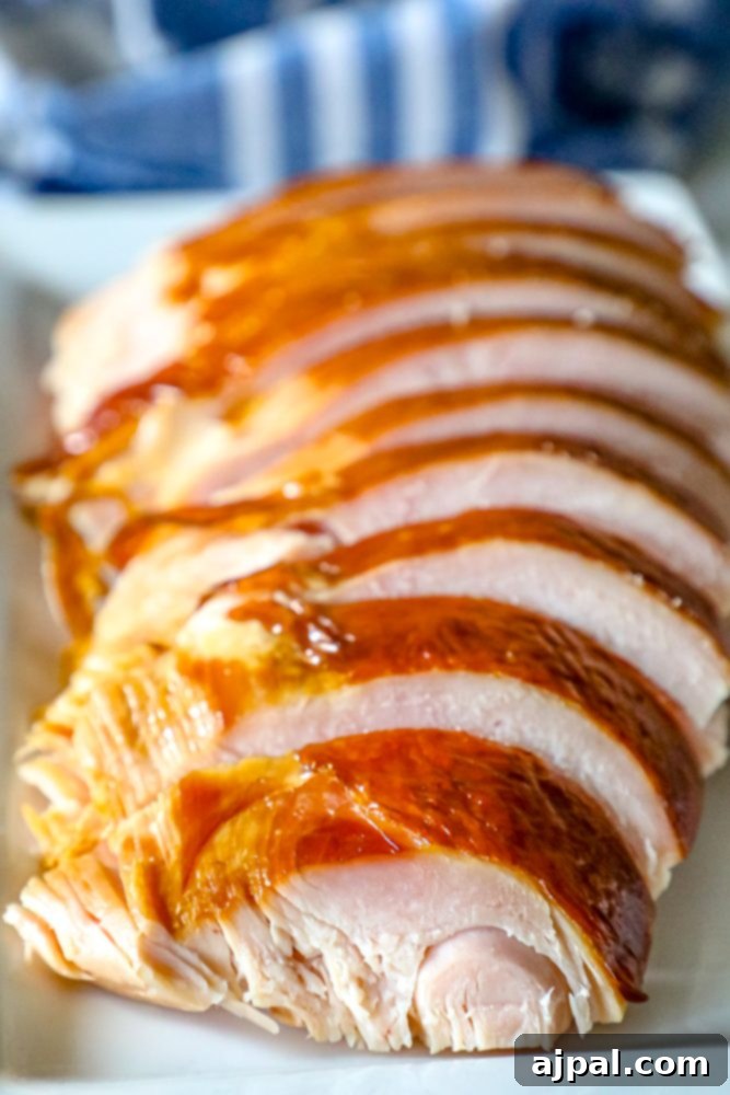 The Ultimate Smoked Turkey 4 picture of sliced smoked turkey on a plate