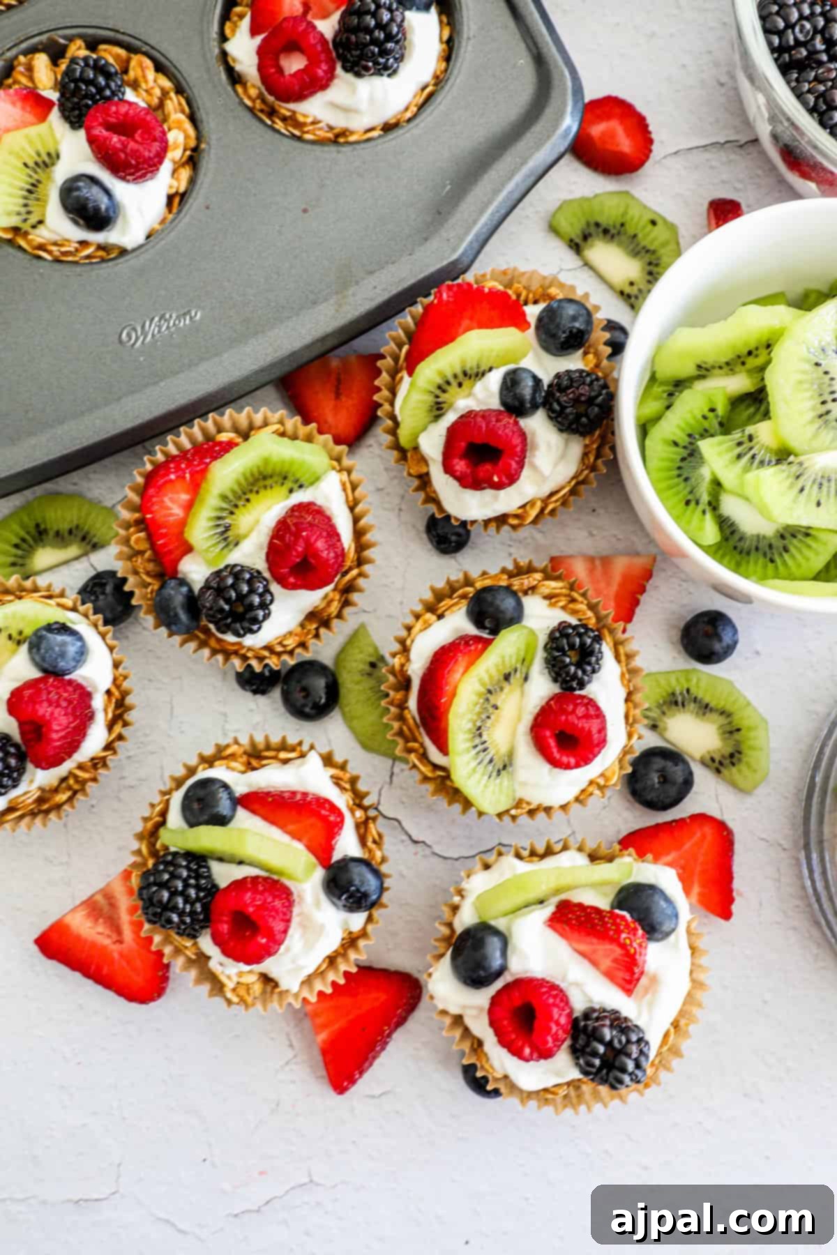 Fruity Granola Bites 6 A beautifully composed granola fruit cup, showcasing its layers of crunchy base, creamy yogurt, and vibrant fresh fruit toppings.